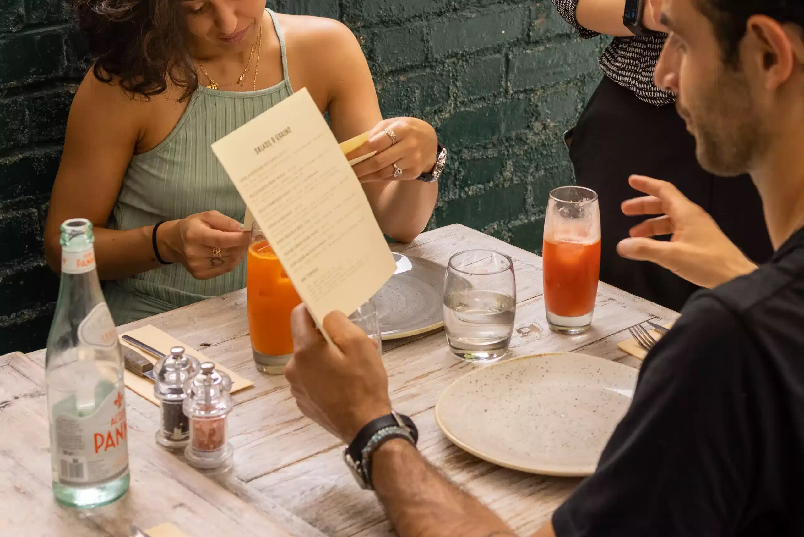 Customers reading the Cocotte Menu
